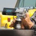 GPI M-150 Pump (ABGAS / JET A Compatible) being stalled on a black fuel tank by a person wearing leather work gloves